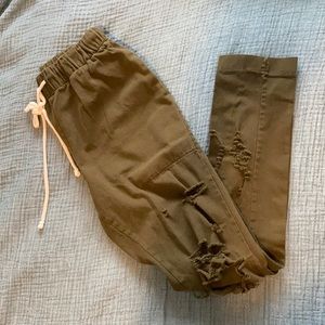 Olive green distressed pants with stretch waist
